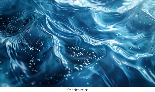 Blue water surface with bubbles
