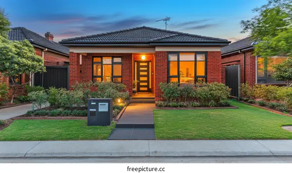 Suburban Brick House Exterior at Dusk