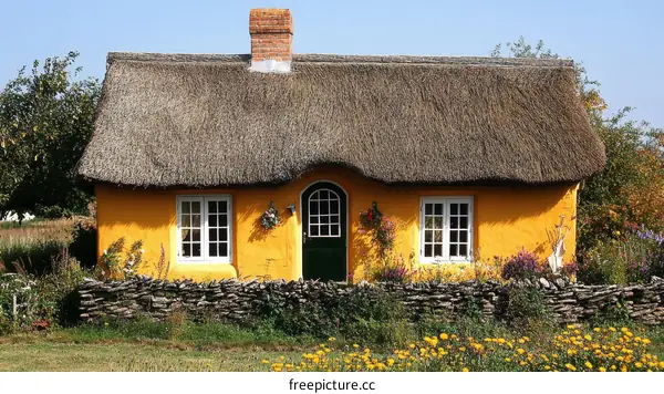 Charming Yellow Thatched Cottage in a Peaceful Rural Setting