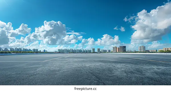 Urban Skyline with Blue Sky and White Clouds