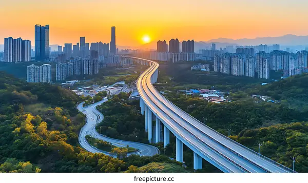 Modern Highway Overlooking City Skyline at Sunset