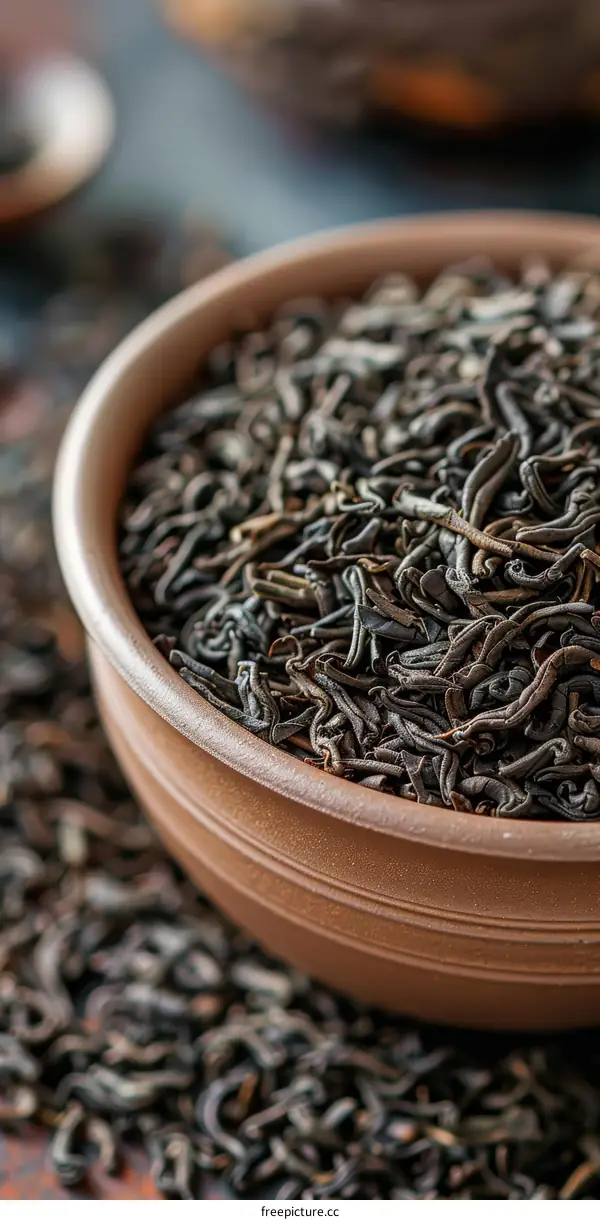 Black tea leaves in a ceramic bowl