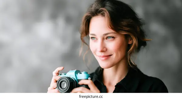 Woman Holding a Vintage Camera Portrait