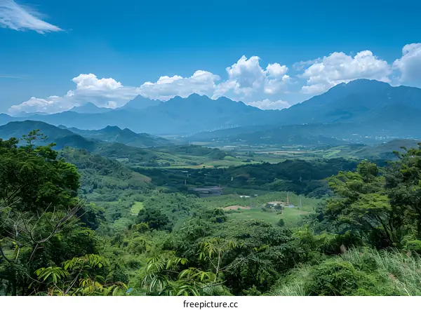 Mountain Range View With Green Trees And Blue Sky