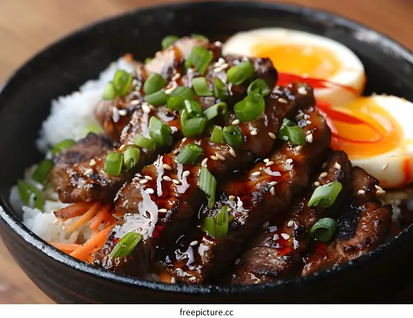 A delicious bowl of beef with rice and vegetables