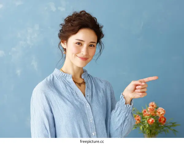 Asian Woman Pointing and Smiling Portrait