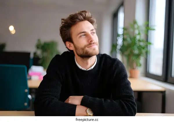 Caucasian Man Contemplating in Modern Office Space