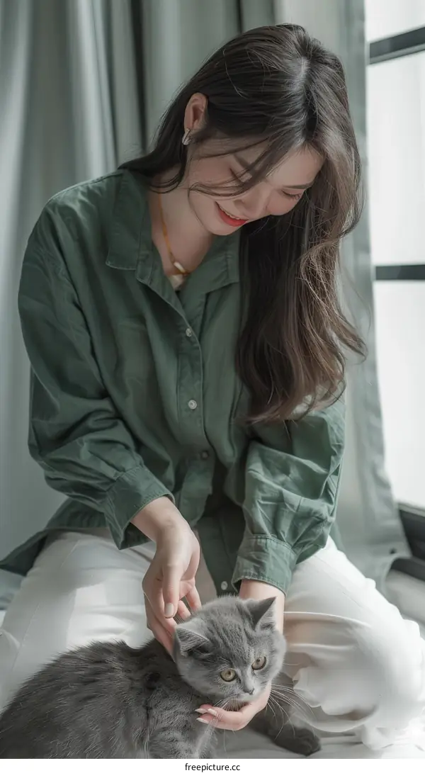 A woman is petting a cat