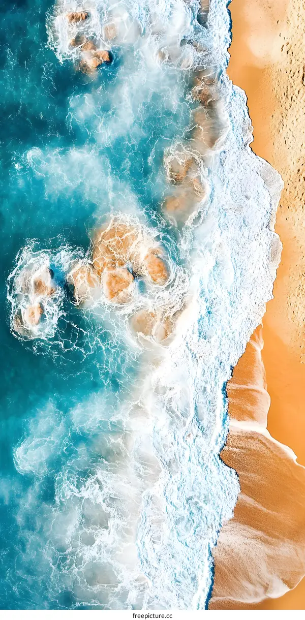 Aerial View of Ocean Waves Crashing on Sandy Beach
