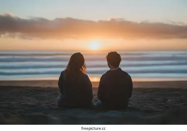 Couple Watching Sunset on the Beach