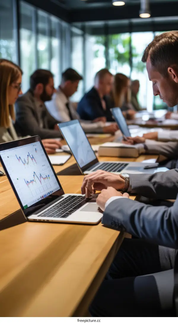 Business professionals in a meeting discussing financial data and graphs