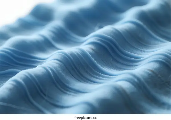 Close-up of Blue Textured Fabric with Wavy Patterns
