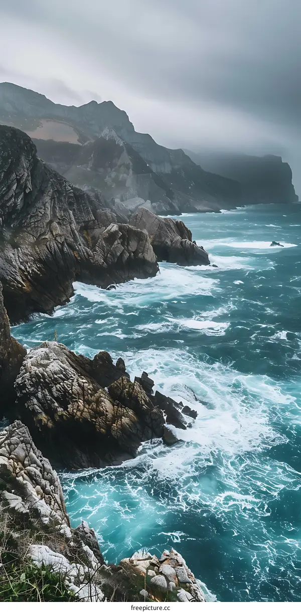 Rocky Coastline With Foamy Waves Crashing On Shore