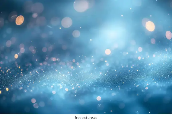 Blue glitter sparkles on a dark blue background.