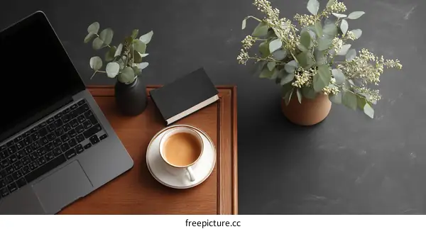 Modern Workspace Flatlay with Laptop, Coffee, and Plants