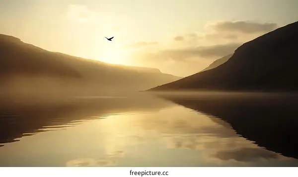 Sunrise over Mountains and Foggy Lake