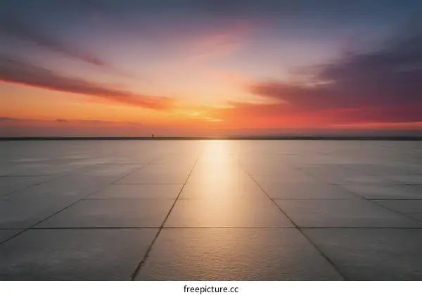 Beautiful sunset over a vast and smooth paved area