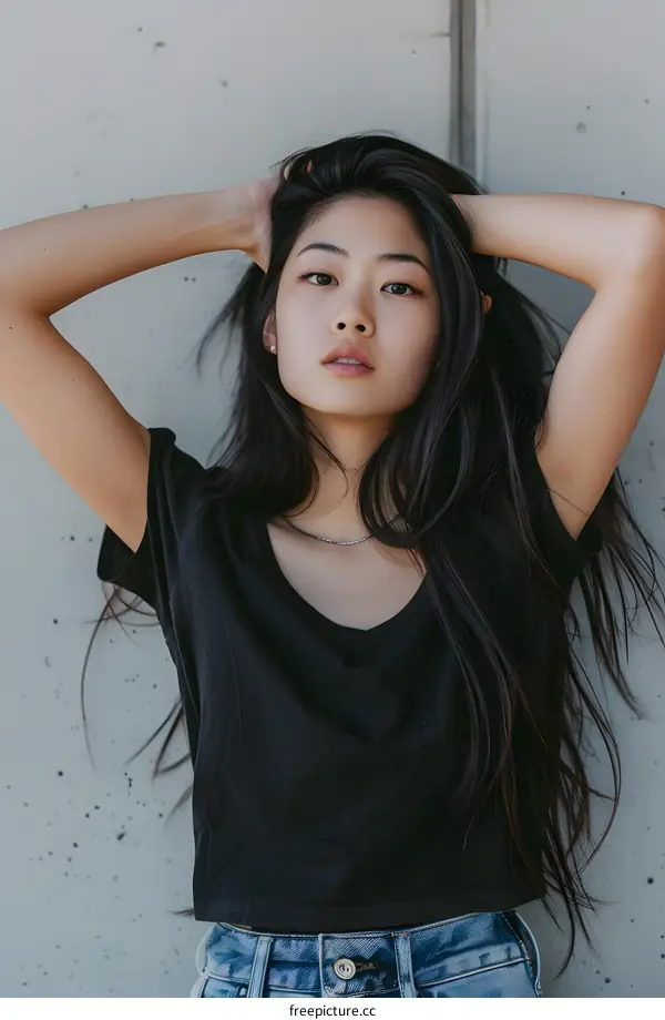 Young Asian Woman with Long Black Hair Wearing a Black T Shirt