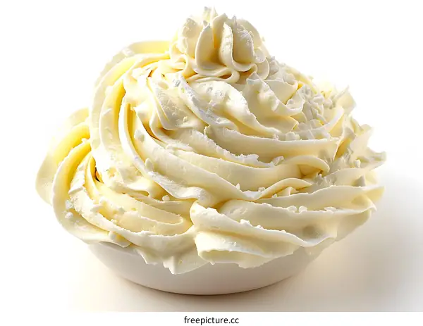 Whipped cream in white bowl