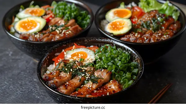 Three bowls of delicious Japanese food