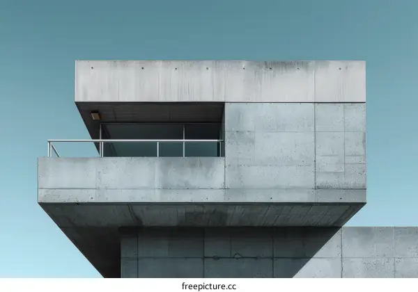 Balcony of a concrete building with a blue sky background