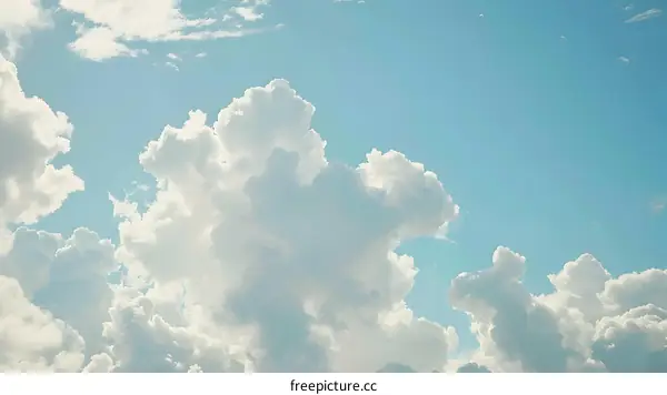 White Clouds Against Blue Sky Background