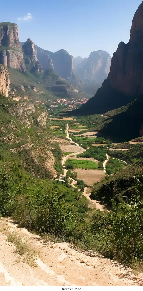 Aerial View of a Valley Surrounded by Mountains