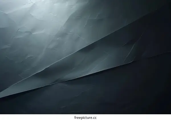 Dark crumpled paper texture background