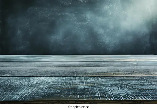 Wooden table with chalkboard background