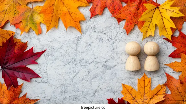 Autumn Leaves Border with Two Wooden Figures