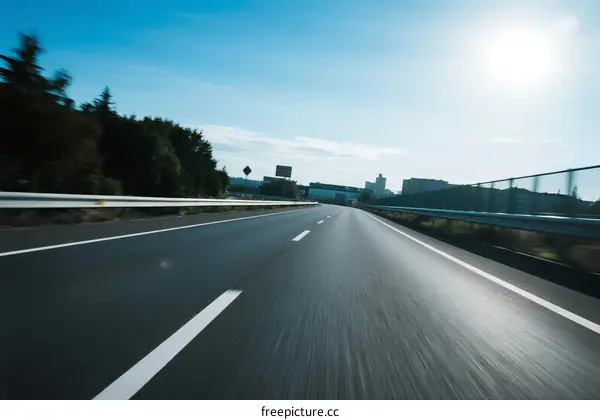 Speeding on an empty highway under bright sunlight
