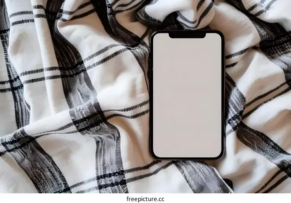 Black Smartphone On White Checkered Cloth