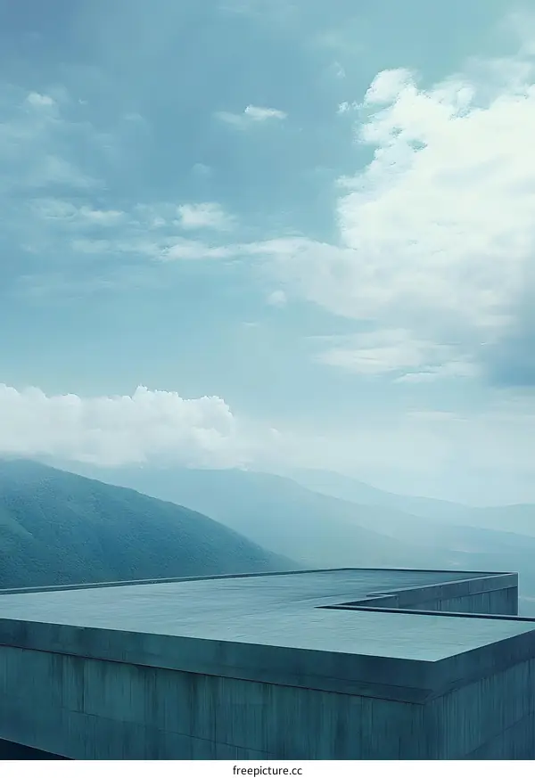 Concrete Rooftop Overlooking Mountains and Blue Sky