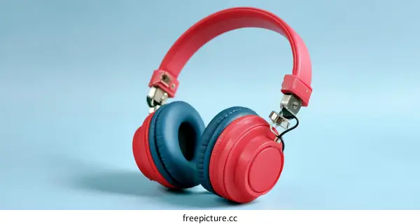 Stylish Red and Blue Headphones on a Light Blue Background
