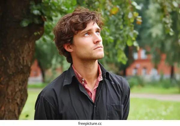 Thoughtful Caucasian Man in Park