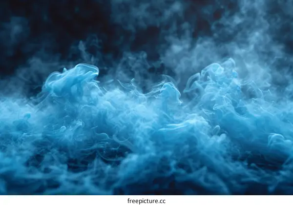 Blue smoke on black background