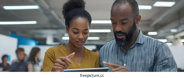 Business Colleagues Working Together on a Tablet