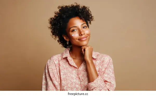 Smiling Black Woman with Sunscreen on Face