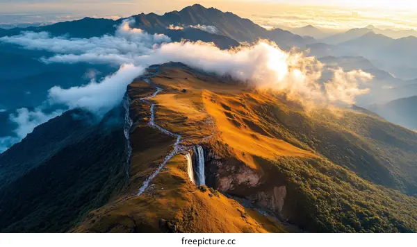 Majestic Mountain Range with Waterfall at Sunrise