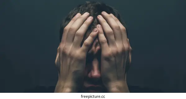 Man holding his head in despair
