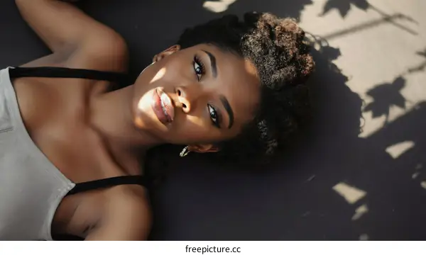 Relaxing Woman with Natural Hair and Soft Lighting
