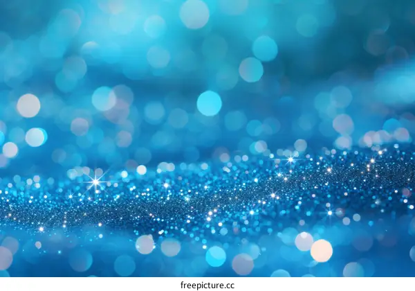 Blue glitter sparkles on a blue background