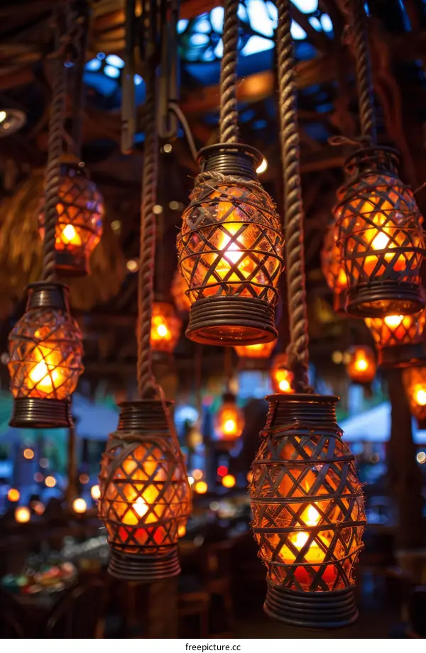 Decorative lanterns with candles hang from the ceiling