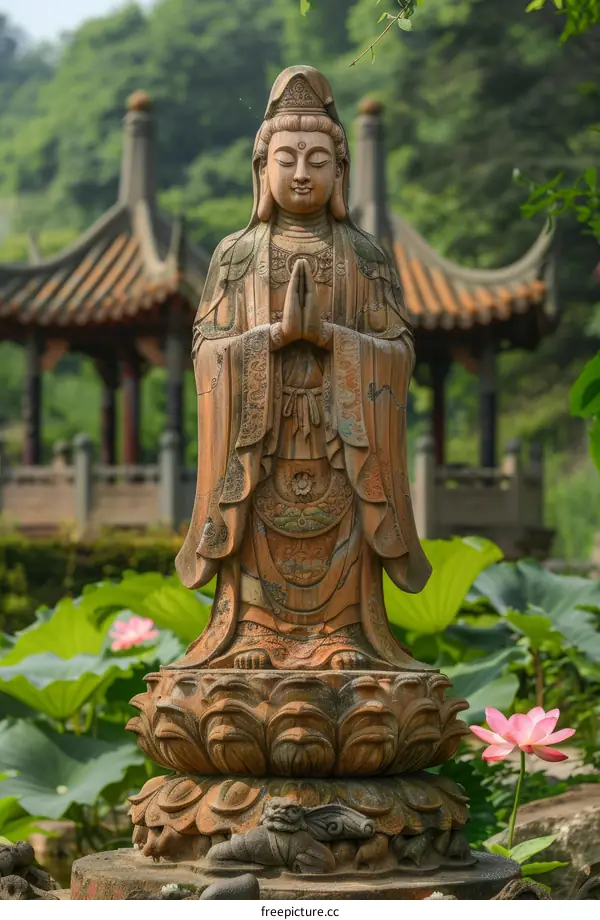 Buddhist Guanyin statue in the lotus pond