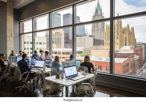 People working in an office with a city view