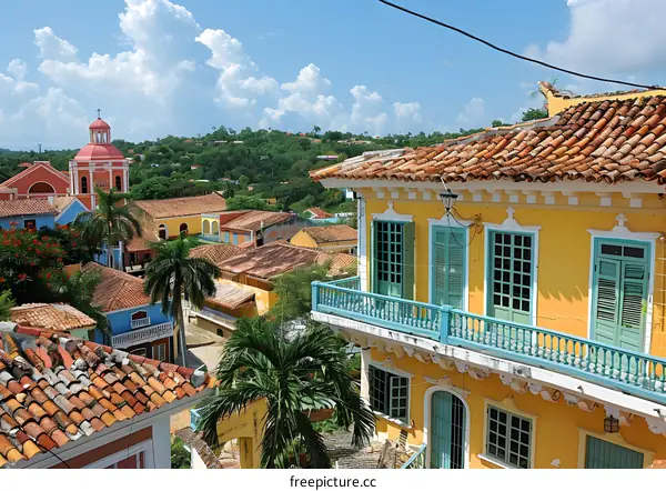 A colorful colonial town with a church in the background