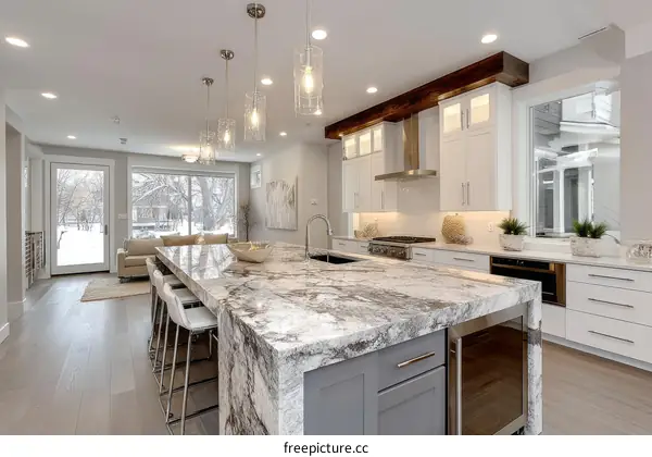 Modern Kitchen with Granite Island and Large Windows