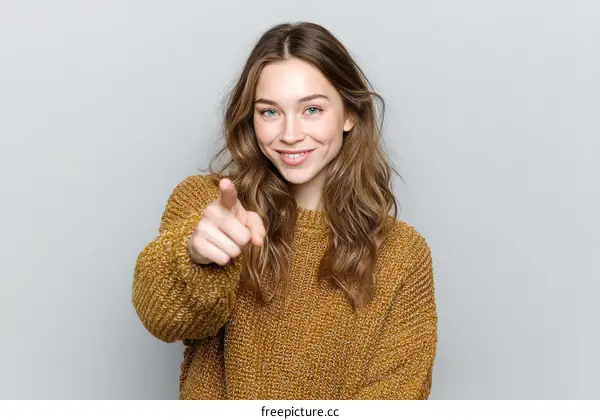 Smiling Woman Pointing at the Viewer