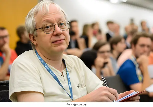 Close Up of a Man Writing Notes in a Conference