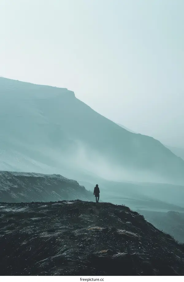 alone person walking on the top of the mountain